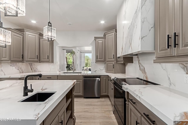 12015 S Tuzigoot Dr, Phoenix, AZ 85044 - kitchen with stainless steel dishwasher, black range with electric cooktop, a sink, gray cabinetry, and recessed lighting