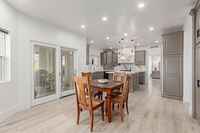 12015 S Tuzigoot Dr, Phoenix, AZ 85044 - dining area with recessed lighting, light wood finished floors, and baseboards