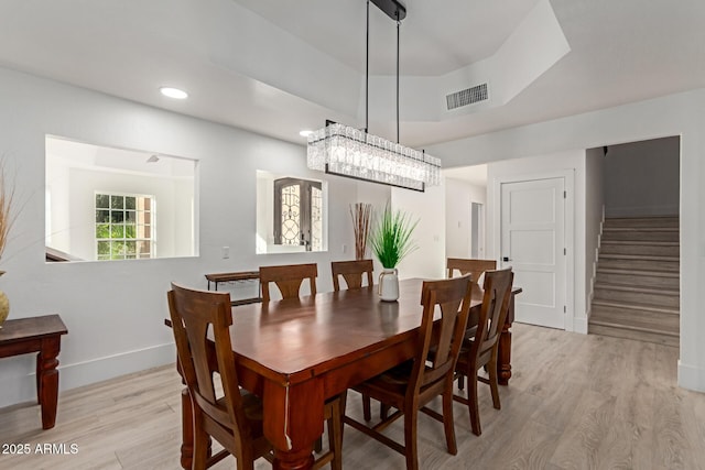 12015 S Tuzigoot Dr, Phoenix, AZ 85044 - dining space with baseboards, stairs, light wood-type flooring, and recessed lighting