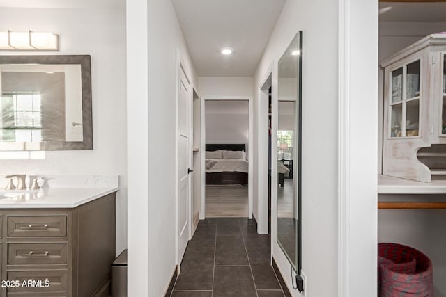 12015 S Tuzigoot Dr, Phoenix, AZ 85044 - full bathroom with ensuite bathroom, vanity, tile patterned floors, and baseboards