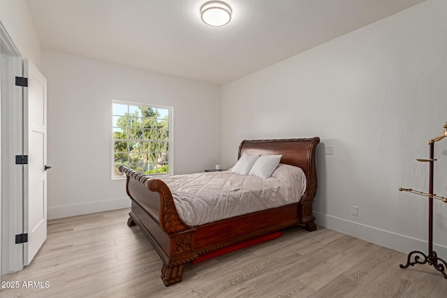 12015 S Tuzigoot Dr, Phoenix, AZ 85044 - bedroom featuring light wood-style flooring and baseboards