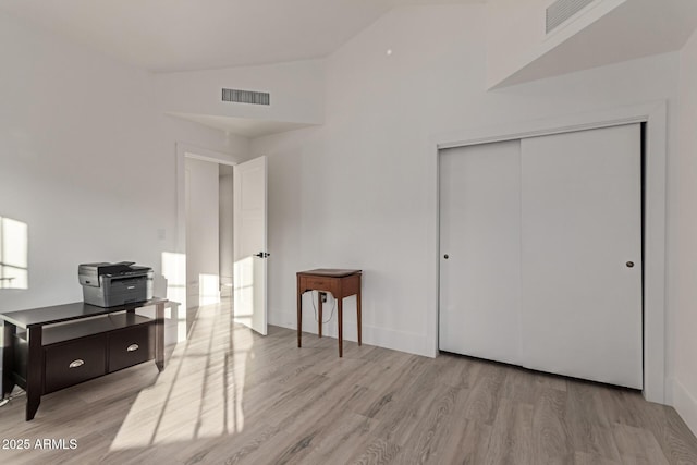 12015 S Tuzigoot Dr, Phoenix, AZ 85044 - office space featuring light wood-style flooring and high vaulted ceiling