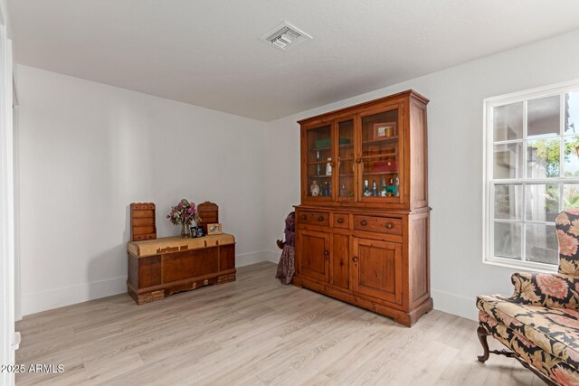 12015 S Tuzigoot Dr, Phoenix, AZ 85044 - sitting room with light wood-style floors and baseboards