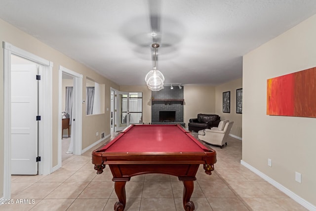 12015 S Tuzigoot Dr, Phoenix, AZ 85044 - playroom with a fireplace, billiards, light tile patterned floors, and baseboards