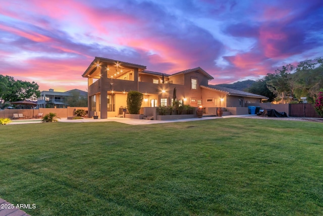 12015 S Tuzigoot Dr, Phoenix, AZ 85044 - view of front of house featuring a balcony, stucco siding, a patio area, and a tile roof