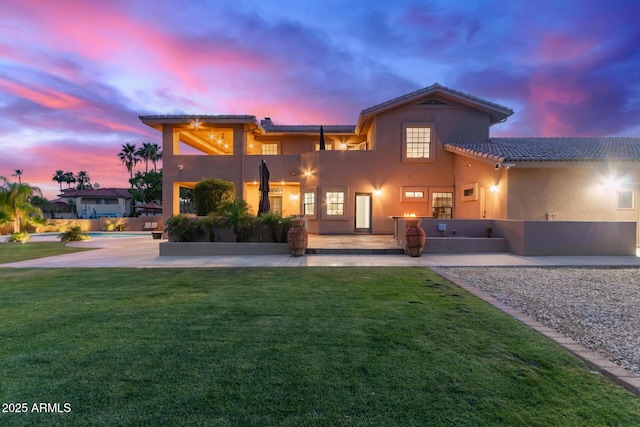 12015 S Tuzigoot Dr, Phoenix, AZ 85044 - back of property with a tile roof, stucco siding, a patio, and a balcony