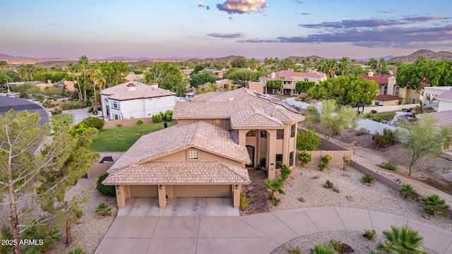 12015 S Tuzigoot Dr, Phoenix, AZ 85044 - aerial view at dusk of a residential view and a mountain view