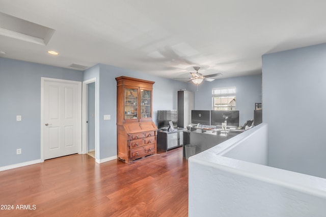 interior space with dark hardwood / wood-style flooring and ceiling fan