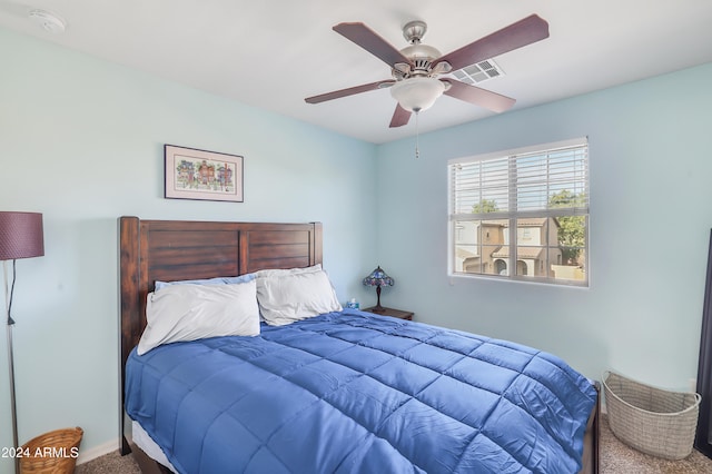 bedroom featuring ceiling fan and carpet