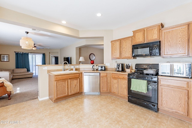 kitchen featuring light carpet, black appliances, sink, light brown cabinetry, and kitchen peninsula