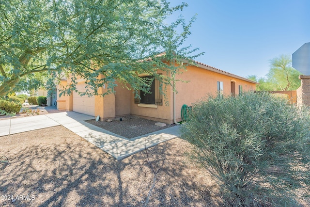 view of property exterior with a garage