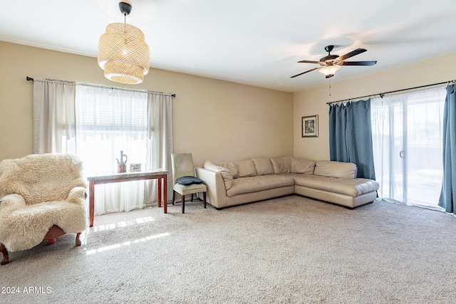 living room featuring carpet flooring and ceiling fan