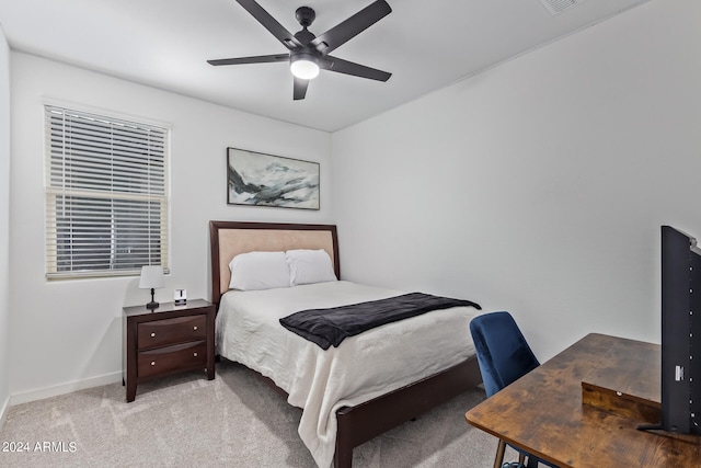 bedroom with light colored carpet and ceiling fan