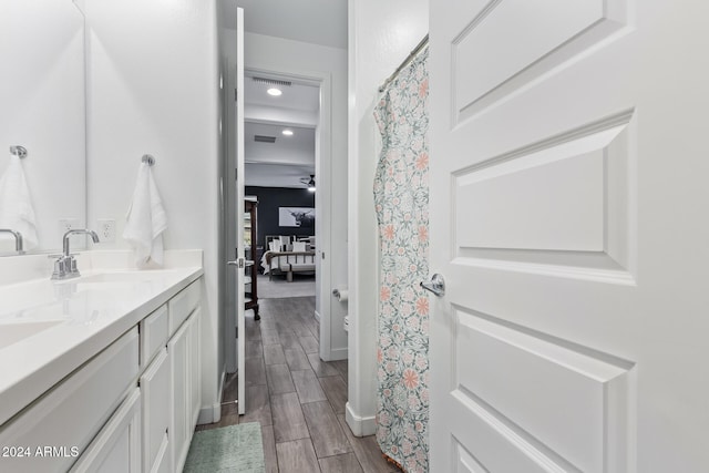 bathroom featuring vanity and hardwood / wood-style flooring