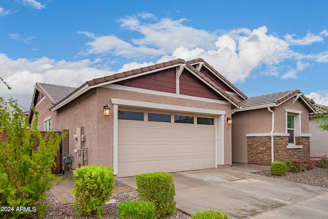 view of front of property with a garage