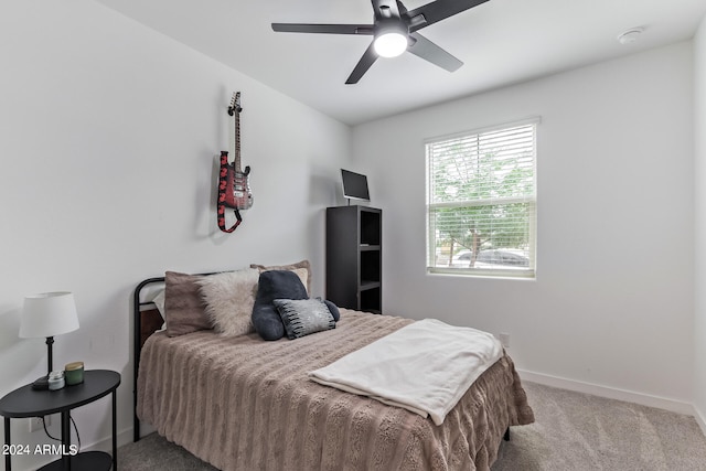 bedroom featuring light carpet and ceiling fan