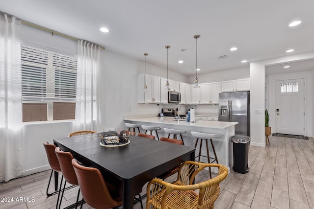 dining room with light hardwood / wood-style flooring