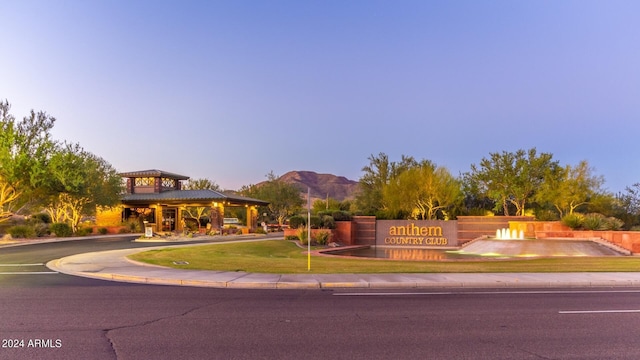 view of front of property featuring a gazebo, a yard, and a mountain view