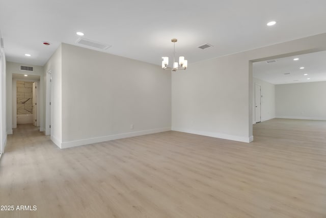 19118 W Fillmore St, Buckeye, AZ 85326 - unfurnished room featuring light wood finished floors, a chandelier, recessed lighting, and baseboards