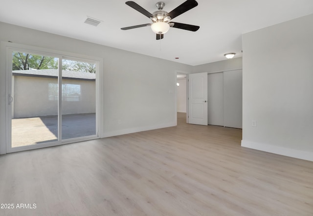 19118 W Fillmore St, Buckeye, AZ 85326 - spare room featuring wood finished floors, baseboards, and ceiling fan