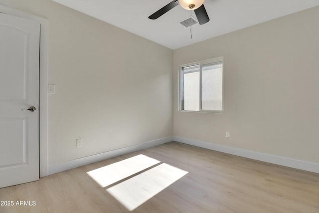 19118 W Fillmore St, Buckeye, AZ 85326 - unfurnished room with wood finished floors, a ceiling fan, and baseboards