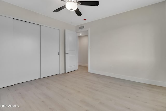 19118 W Fillmore St, Buckeye, AZ 85326 - unfurnished bedroom featuring wood finished floors, a closet, baseboards, and ceiling fan