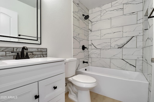 19118 W Fillmore St, Buckeye, AZ 85326 - bathroom with vanity, toilet, bathtub / shower combination, and wood finished floors