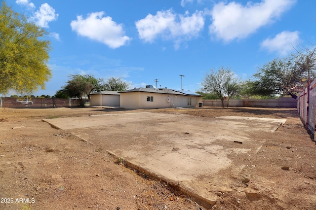 19118 W Fillmore St, Buckeye, AZ 85326 - back of house featuring a fenced backyard and roof mounted solar panels