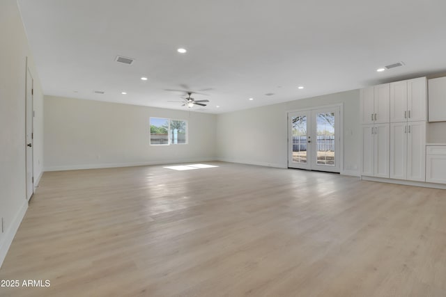 19118 W Fillmore St, Buckeye, AZ 85326 - empty room featuring baseboards, recessed lighting, ceiling fan, light wood finished floors, and french doors