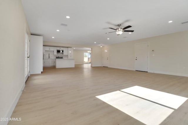 19118 W Fillmore St, Buckeye, AZ 85326 - unfurnished living room with ceiling fan, light wood-type flooring, recessed lighting, and baseboards