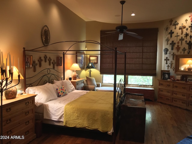 bedroom with ceiling fan and dark hardwood / wood-style floors