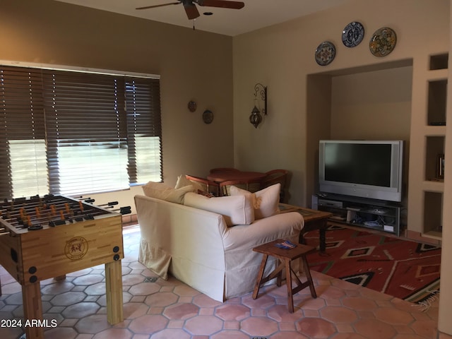 tiled living room featuring ceiling fan