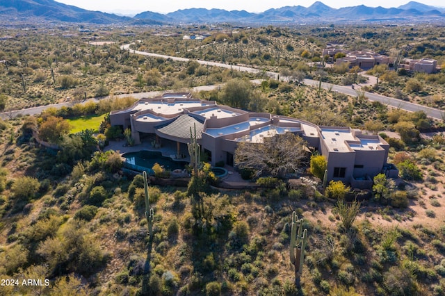 birds eye view of property featuring a mountain view