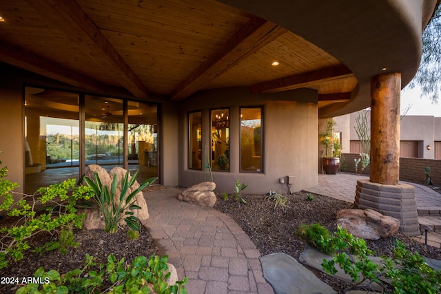 property entrance featuring a patio area