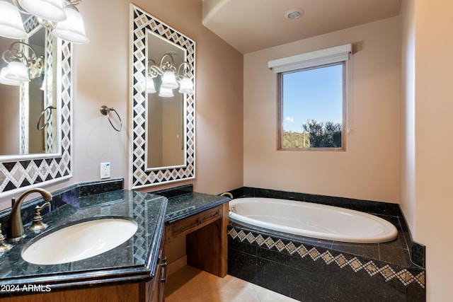 bathroom with tile flooring, tiled bath, and vanity with extensive cabinet space