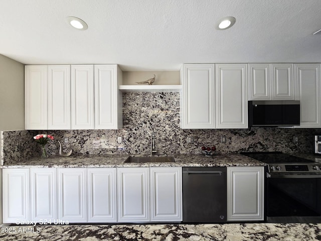 kitchen with decorative backsplash, sink, electric range oven, and white cabinets