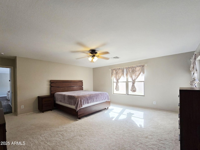 unfurnished bedroom with light carpet and ceiling fan