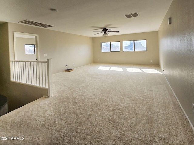 carpeted empty room with ceiling fan