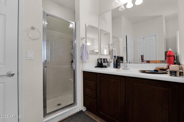 full bathroom featuring vanity and a stall shower