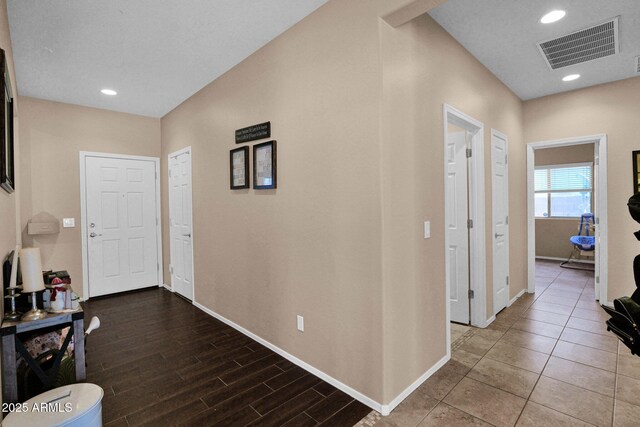 corridor with visible vents and baseboards