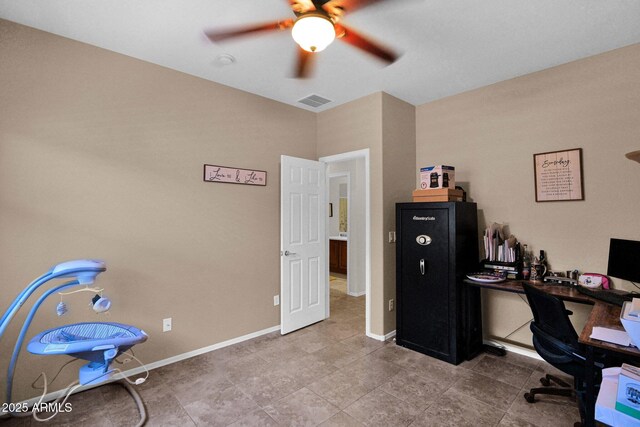 office area featuring tile patterned flooring, ceiling fan, baseboards, and visible vents