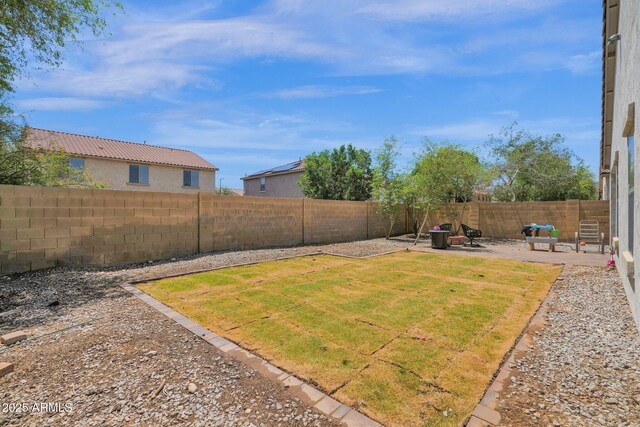 view of yard with a fenced backyard and a patio area
