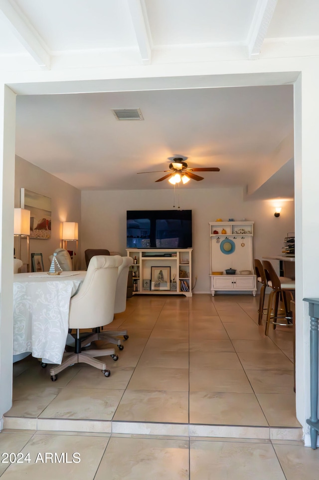 living room with beam ceiling and ceiling fan