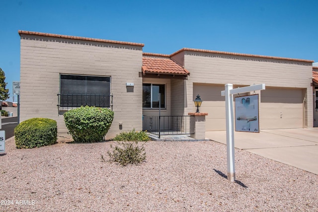 4502 E Carol Ave Unit 1, Mesa, AZ 85206 - view of front of property with a tile roof, driveway, and a garage