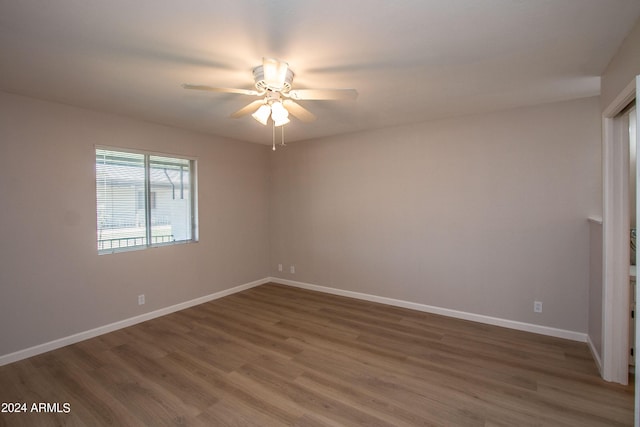 4502 E Carol Ave Unit 1, Mesa, AZ 85206 - unfurnished room with dark wood-style floors, baseboards, and a ceiling fan