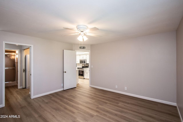 4502 E Carol Ave Unit 1, Mesa, AZ 85206 - unfurnished bedroom with a ceiling fan, wood finished floors, baseboards, and visible vents