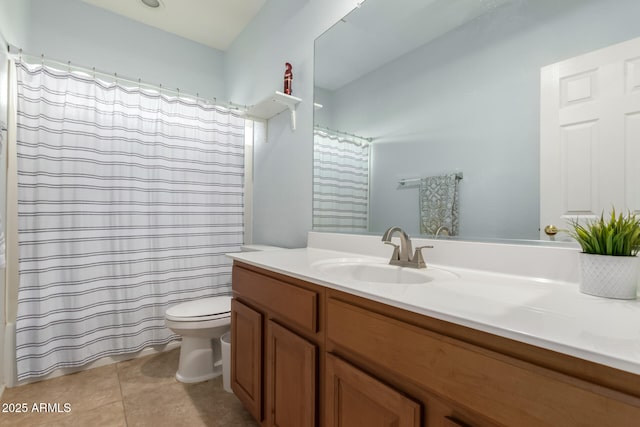 bathroom featuring toilet, a shower with curtain, tile patterned flooring, and vanity