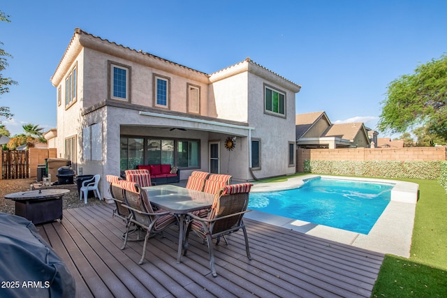 view of swimming pool with a fenced in pool, outdoor dining area, an outdoor hangout area, a deck, and a fenced backyard