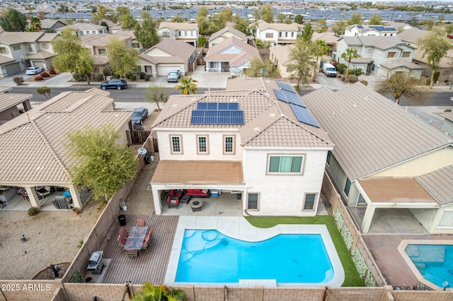 view of pool with a patio area, a fenced backyard, a residential view, and a fenced in pool