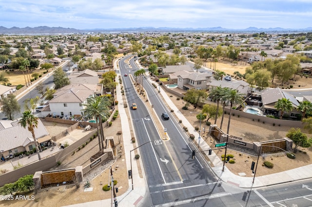 drone / aerial view featuring a residential view and a mountain view